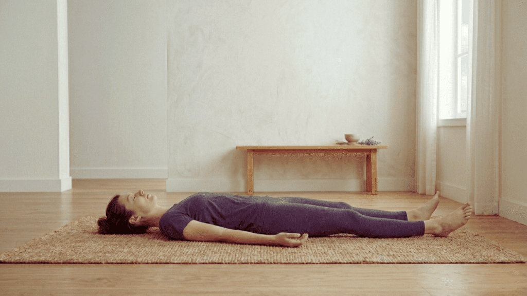 Person practicing relaxation breathing and muscle release indoors